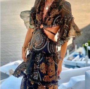 Spring summer 2022 Elisabetta Franchi A knitted calf-length dress with safari charms belt
