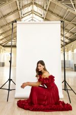 Clothes MAESTRI EVENING GLOW OFF-SHOULDER MAXI DRESS WITH DRAMATIC RUFFLED BODICE, FLOWING PLEATED SKIRT AND ROMANTIC FLORAL HEM DETAIL